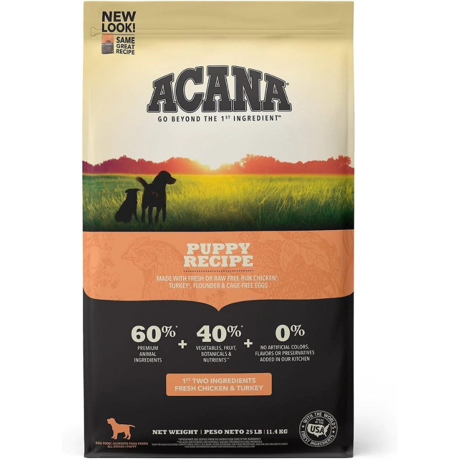 Front of an ACANA Puppy Recipe dog food bag displaying branding, “60% premium animal ingredients,” “40% vegetables, fruit & nutrients,” and “0% artificial colors, flavors, or preservatives.”