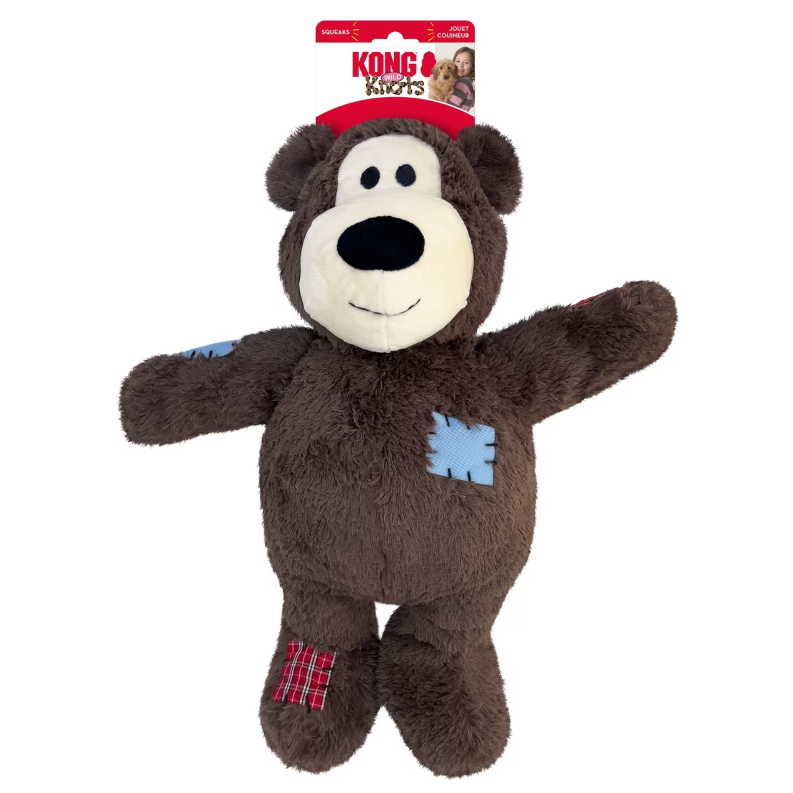 Front of KONG Wild Knots Bear jumbo plush dog toy packaging. Shows the large plush bear attached to branded backing with labels indicating squeaks and durable construction.