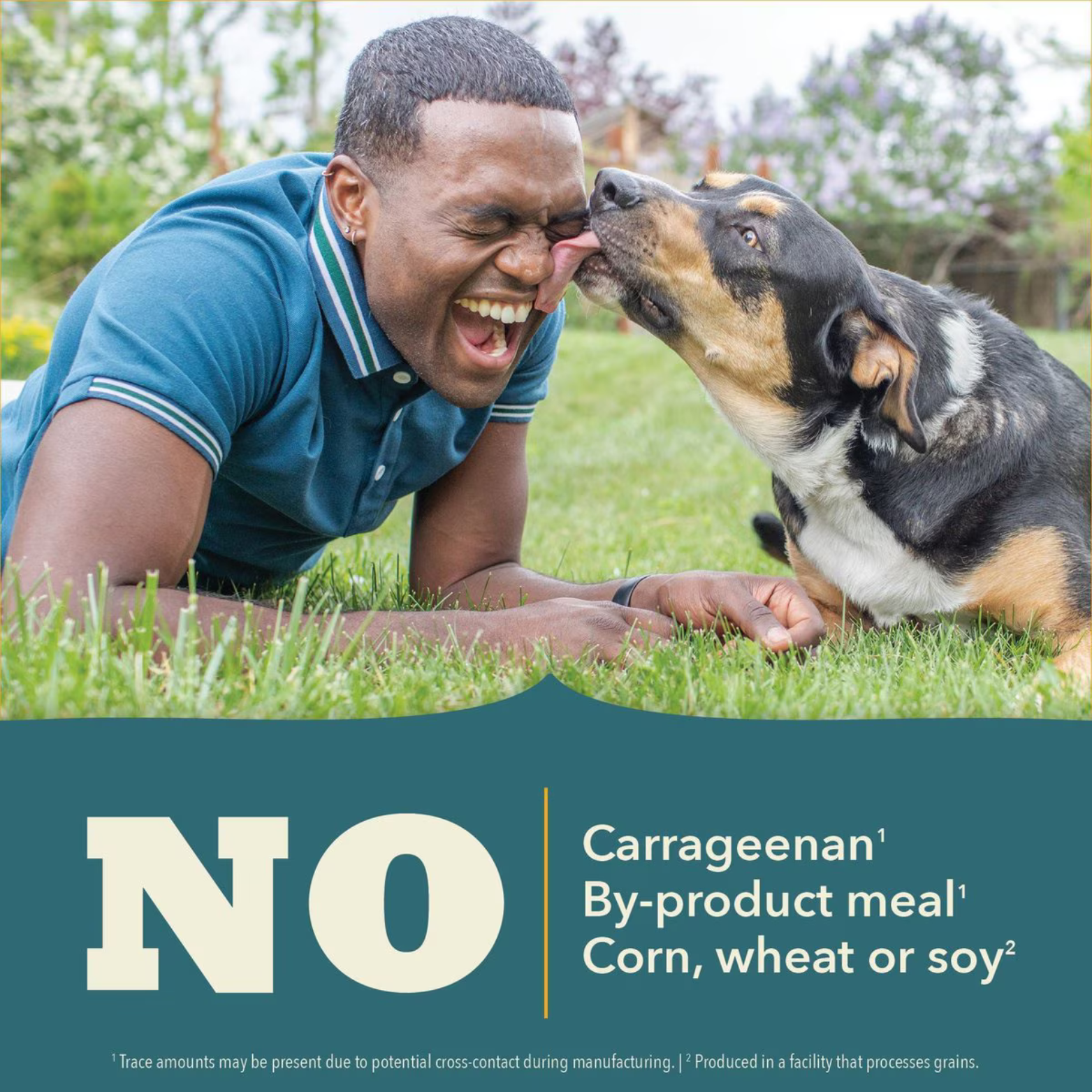 Photo of a dog licking a smiling person’s face outdoors above text stating “No carrageenan, by-product meal, corn, wheat or soy.”