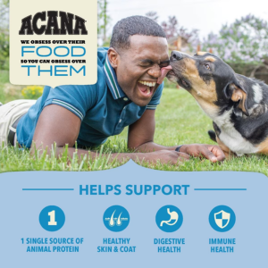 A person lying on grass smiling while a dog licks their face, with text highlighting benefits including a single source of animal protein, healthy skin and coat, digestive health, and immune health.
