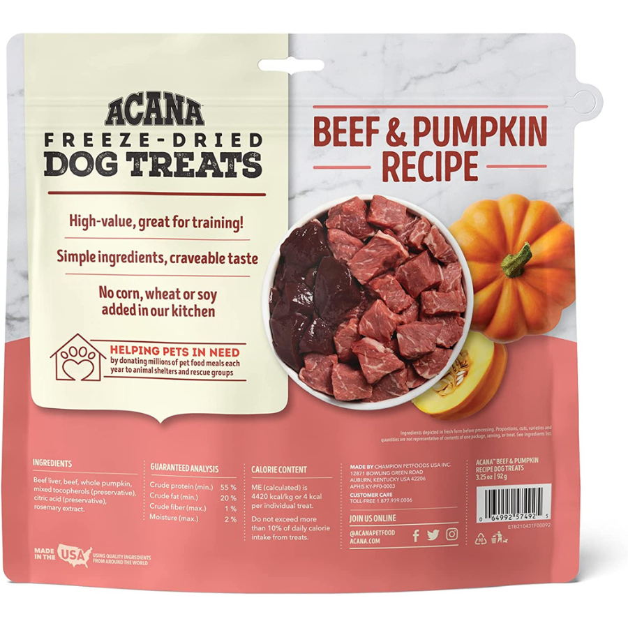 The back of the Acana Beef & Pumpkin treats bag. It features marketing claims such as "High-value, great for training!" and "No corn, wheat, or soy." A central image shows a bowl of raw beef cubes and liver next to a whole pumpkin. The bottom section provides the full ingredient list, guaranteed analysis, calorie content, and manufacturer information for Champion Petfoods.