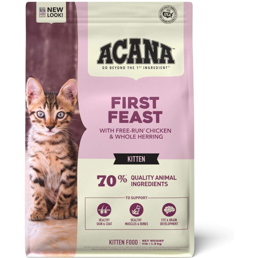 Front of the ACANA First Feast kitten food bag featuring a tabby kitten, the product name “First Feast with free-run chicken & whole herring,” “70% quality animal ingredients,” and icons for skin and coat health, muscle and bone development, and eye and brain development.